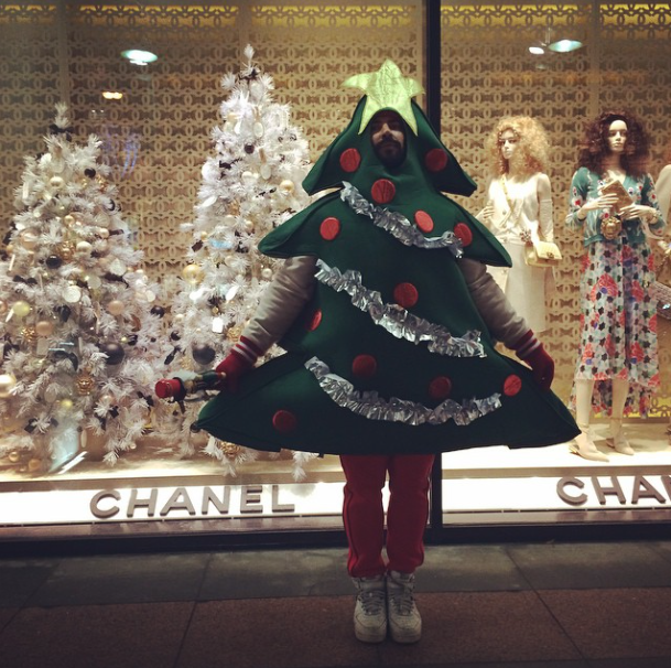 Petel poses in front of Chanel as a Christmas Tree